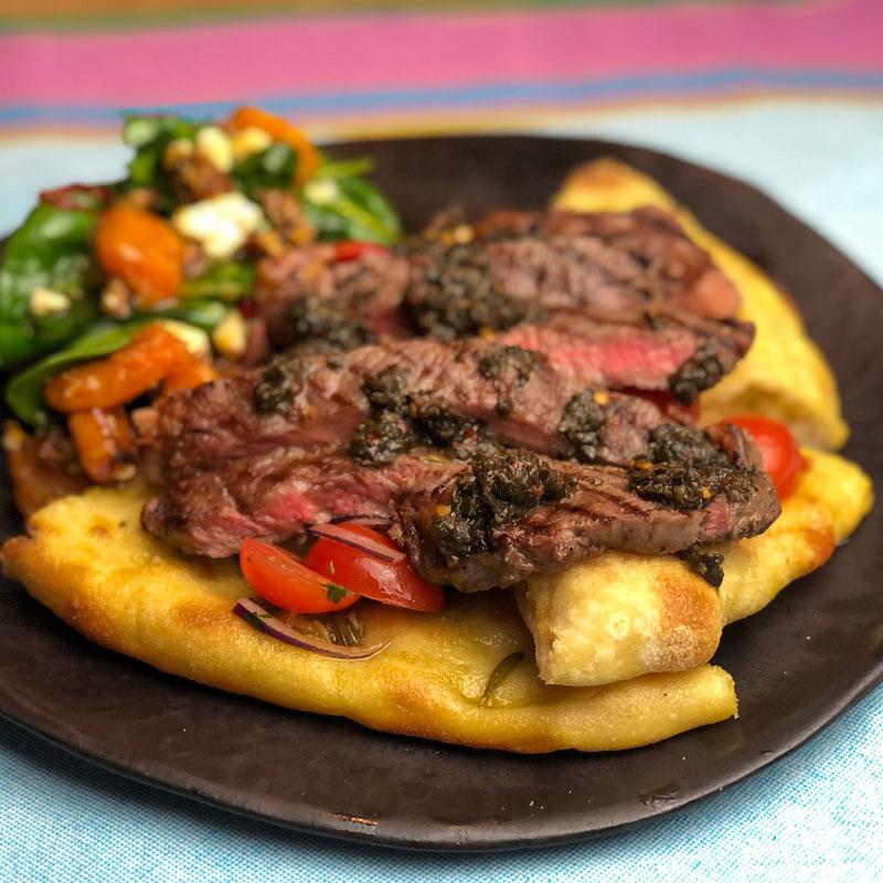 Rib Eye Steak with Chimichurri, Flat Breads, Tomato and Onion Salad by Somerset Foodie